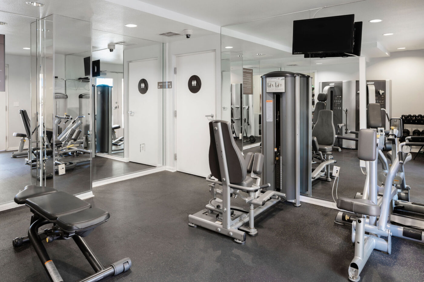 Indoor fitness center with equipment and mirrors