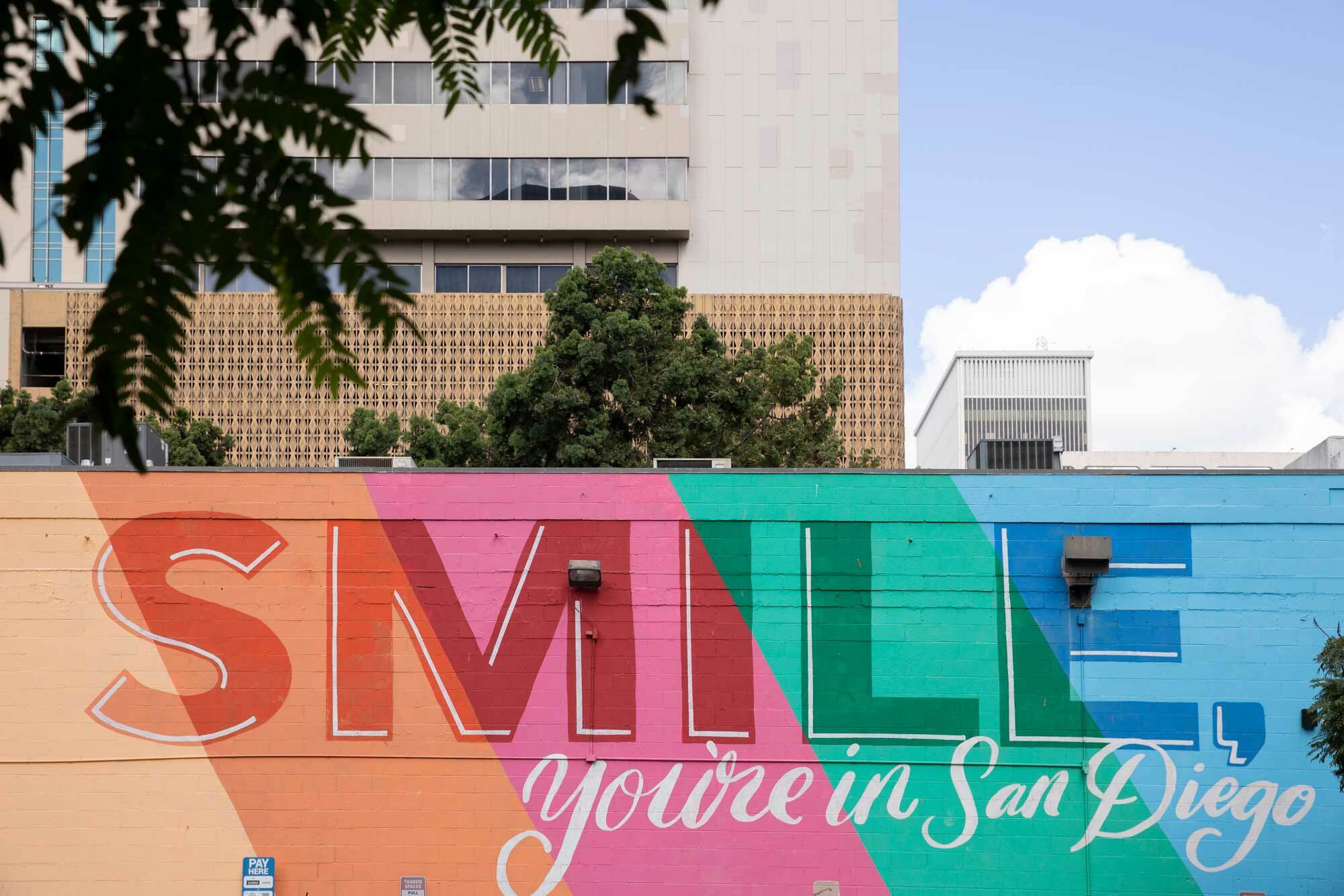 large outdoor mural reading "smile you're in San Diego"